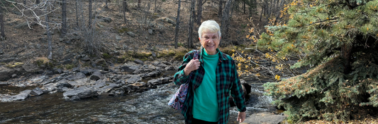 Sally by a stream in the Colorado mountains