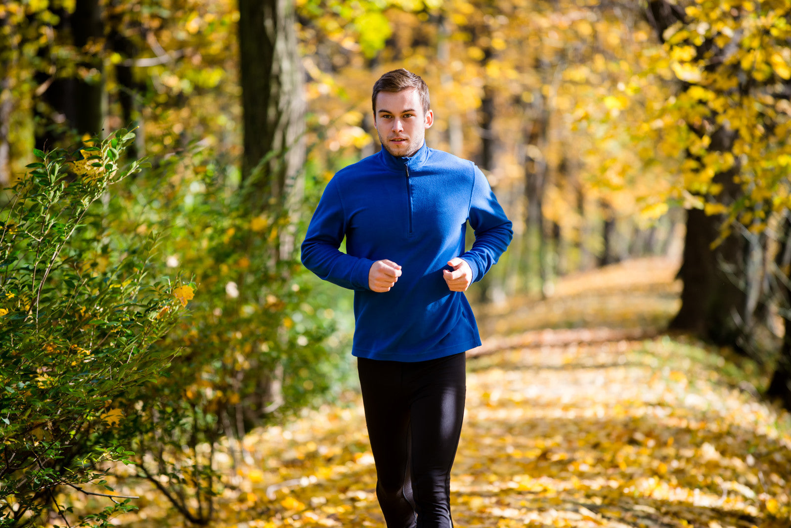 Man running illustrates some of the benefits of probiotics. They help with digestion and assimilation, regular bowel movements. They strengthen the immune system and fight pathogenic bacteria, viruses and yeast.